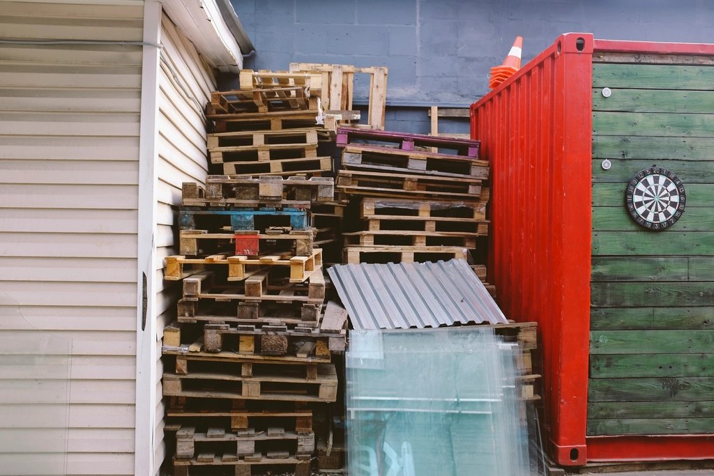 Pallets stacked corrugated steel garbage